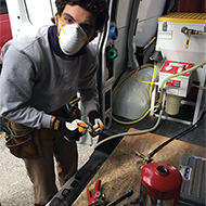 Photo of Tech Servicing Extinguishers