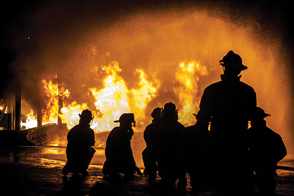 Firemen putting out flames